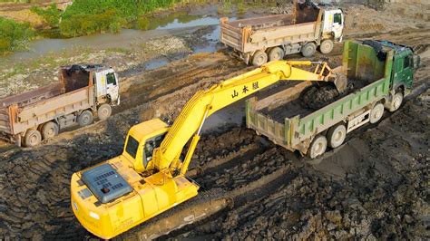 mini excavator loading dump truck|excavator scoops dump truck video.